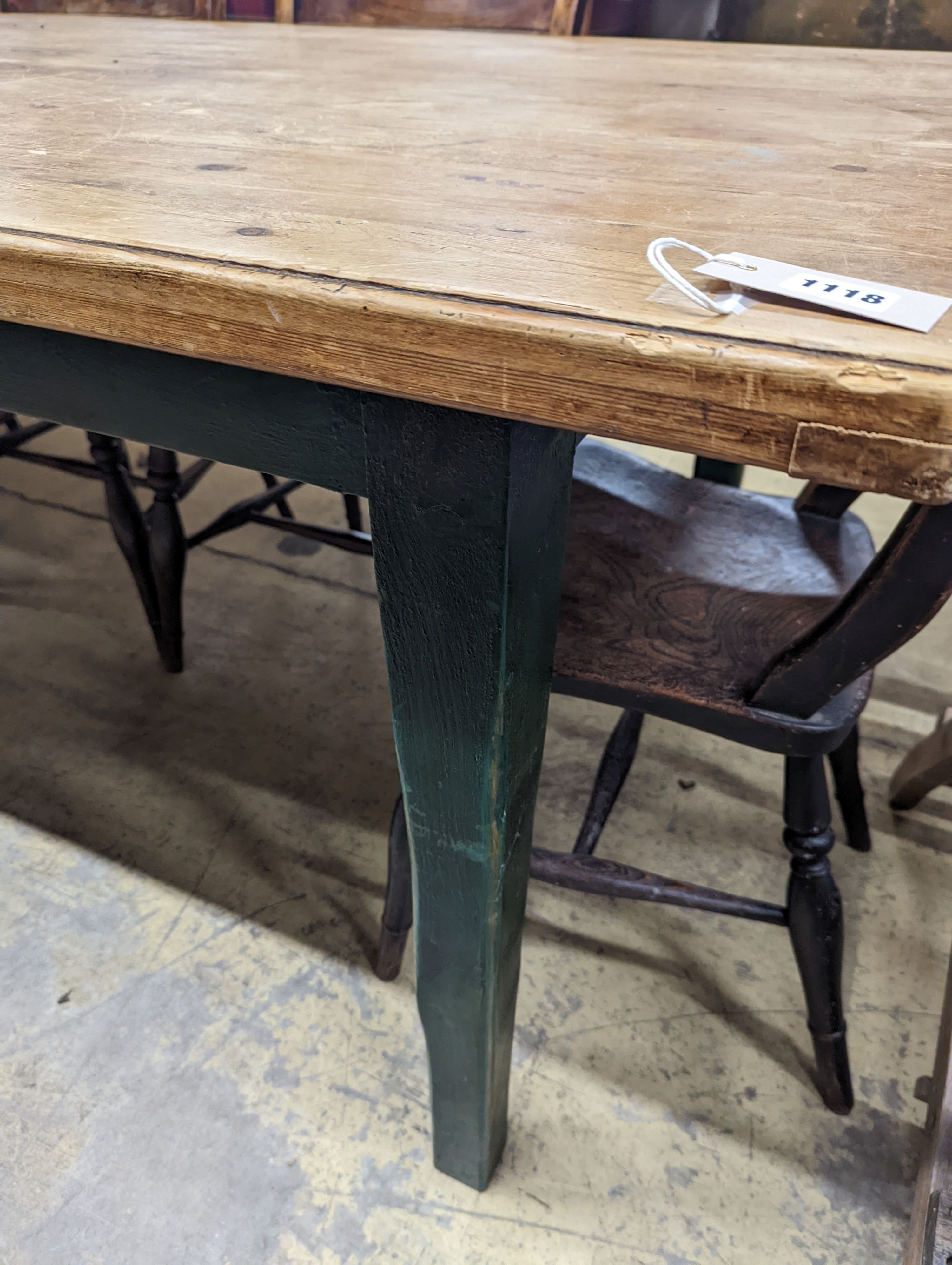 A rustic farmhouse pine kitchen table with painted legs, length 192cm, depth 85cm, height 76cm